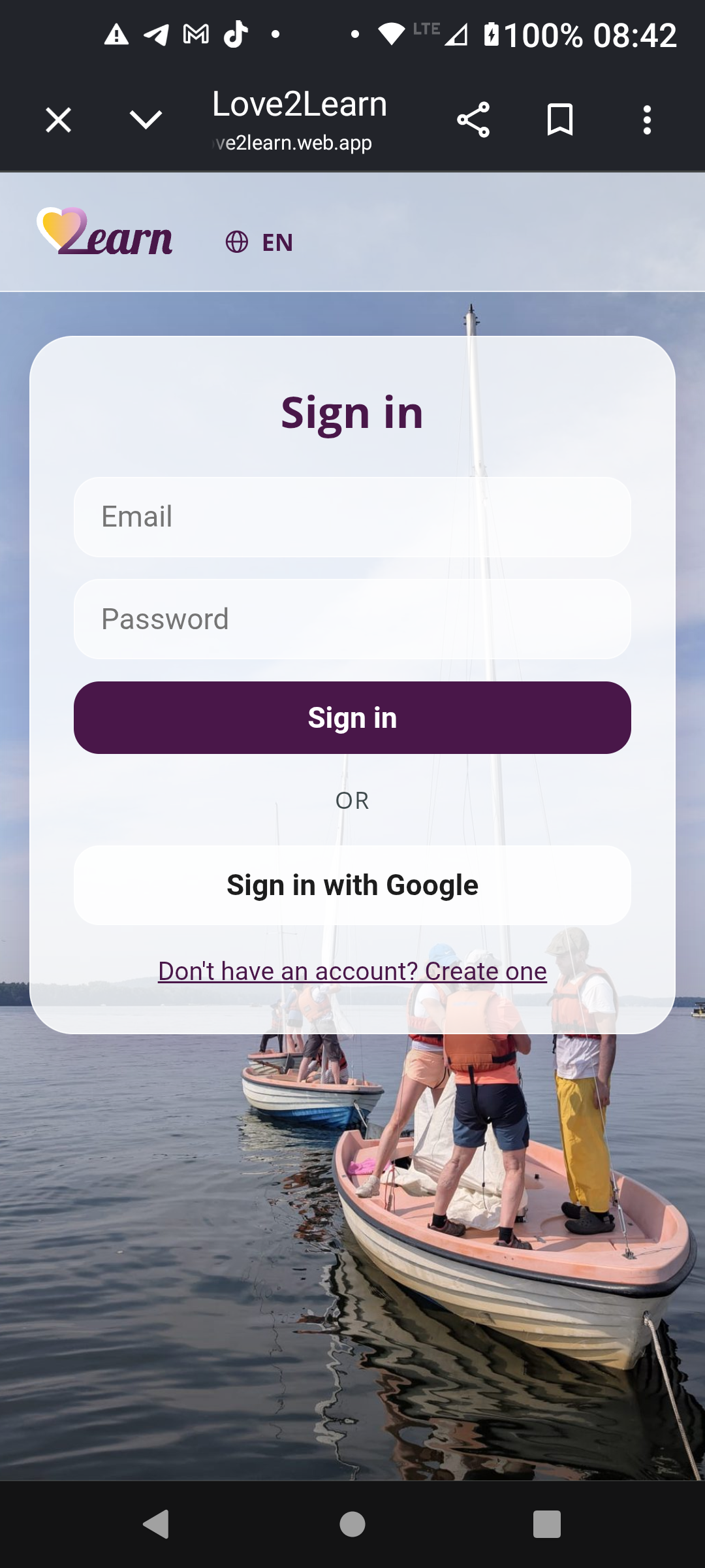 Love2Learn sign in screen over a sailing photo backdrop